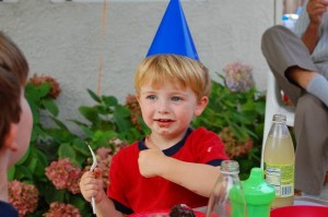 Caden eating a cake