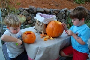 Boys carving pumpkins